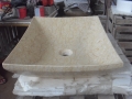 Évier de salle de bains en marbre beige de forme rectangulaire